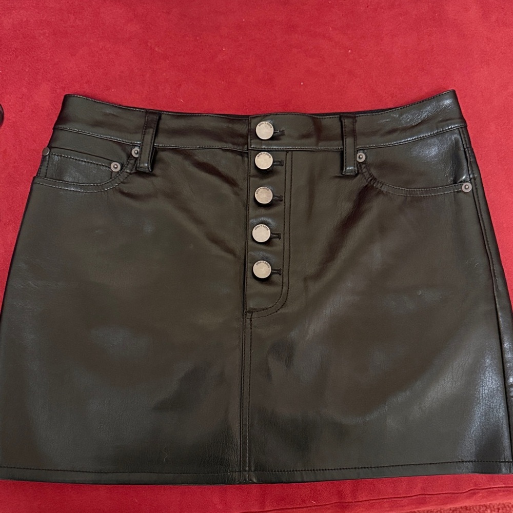 Black Faux Leather Mini Skirt . Buttery soft. New but tags removed.